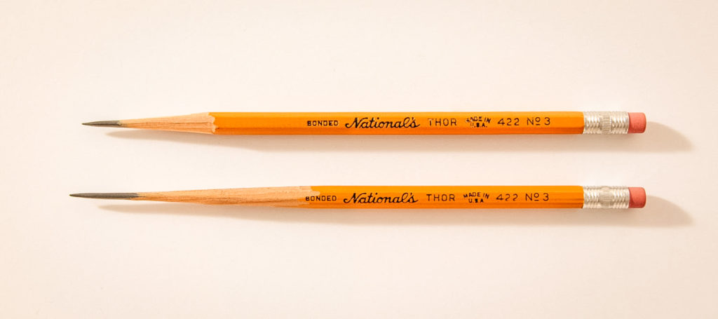 Two Thor pencils of different shaved pencil point lengths