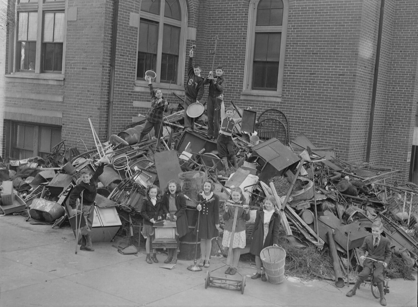 American children collecting scrap metal to support the war